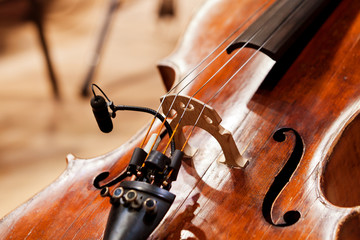  Fragment of a cello with a microphone in the orchestra close-up