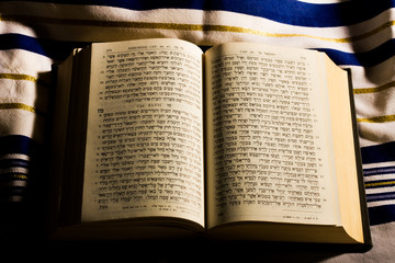 Fototapeta premium Hebrew prayer book and a tallit, a jewish prayer shawl