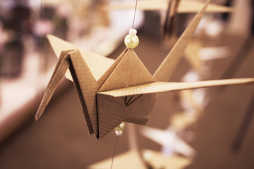 Folded brown paper bird