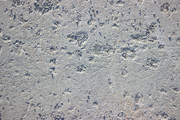 Aged cracked concrete stone plaster wall background and texture style, road texture.