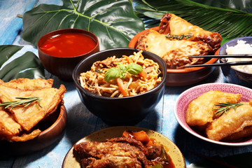 Assorted Chinese food set. Chinese noodles, fried rice, peking duck, dim sum, spring rolls. Famous Chinese cuisine dishes on table. Chinese restaurant