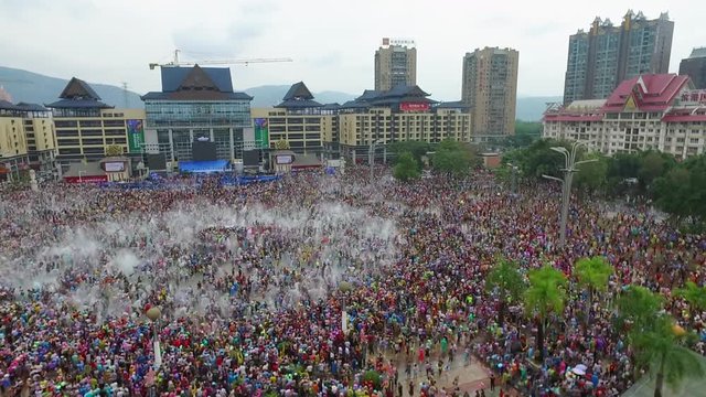 People celebrating water splashing festival (Songkran) in southern China