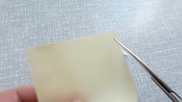 utting corners idiom Briticism hand takes sheet of paper and cutting corners by scissors doing something so easily and cheaply as possible