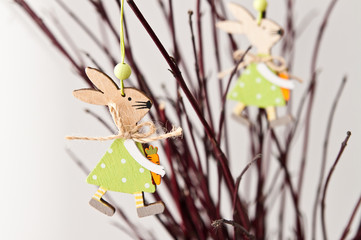 Easter bunny decoration with twigs on white