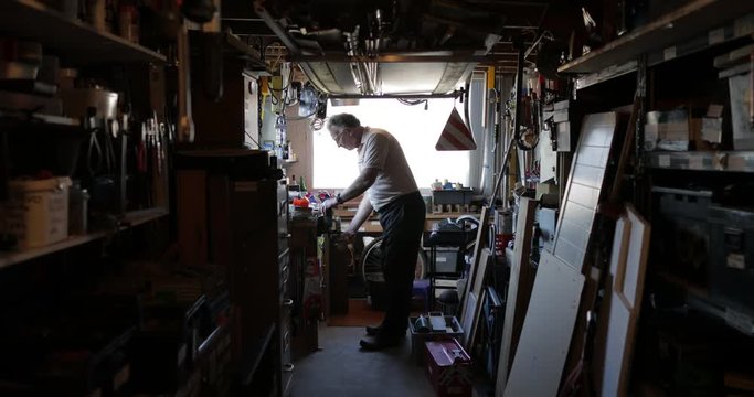 Senior Man Working in his Workshop