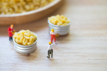 Miniature people chef select moong dal namkeen fresh and crisp. grains dried vegetarian food ingredient.