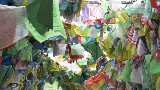 Colorful Tibetan prayer flags swaying in the wind in the temple, Ulan Ude Russia