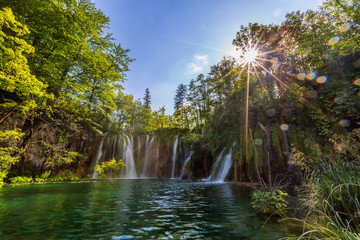 Waterfall in sunny summer day, Plitvice Lakes National Park, Croatia