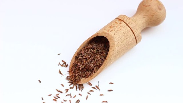 Seeds of cumin in a scoop