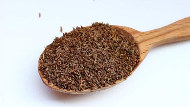 Seeds of cumin in a spoon
