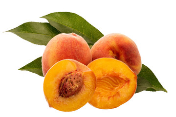 ripe peaches with leaves close up isolated on white background