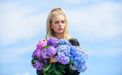 Girl tender blonde hold hydrangea bouquet. Skin care and beauty treatment. Springtime bloom. Gentle flowers for delicate woman. Pure beauty. Tenderness of young skin. Beauty of spring season