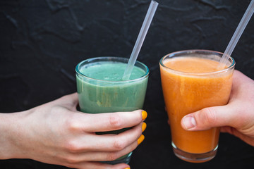Well being and weight loss concept, spirulina and banana smoothies. On wooden table with ingredients, from above.