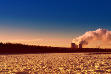 cooling towers emit steam at a nuclear power plant located on the shore of the Bay.Cooling of...