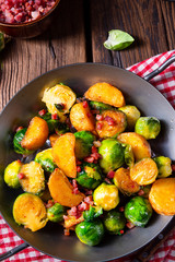 Brussels sprouts potato pan with bacon in rustic style
