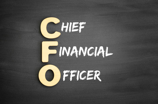 Wooden alphabets building the word CFO - Chief Financial Officer acronym on blackboard