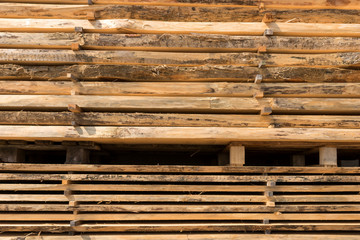 Wooden storage area of carpentry. Pile of wood for the construction industry
