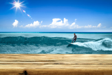 Summer table background of free space and surfer on waves. 
