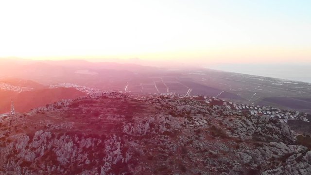 Aerial drone view of telecommunication antennas at sunset, in Segaria mountain, in Marina Alta, Alicante, Spain