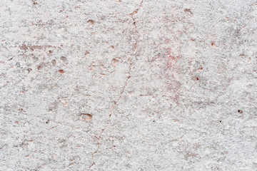 Wall fragment with scratches and cracks