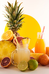 A glass of fruit juice on a white background. Delicious, tasty, fresh, summer set. Sweet, exotic beverage with fruits.