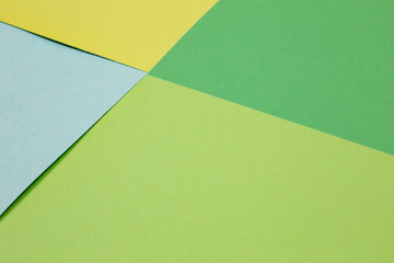 sheets of colored paper. Many colored sheets of paper are laid out in the harsh composition. background of colored paper.