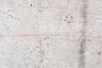 Wall fragment with scratches and cracks