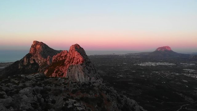 Aerial drone view of telecommunication antennas at sunset, in Segaria mountain, in Marina Alta, Alicante, Spain
