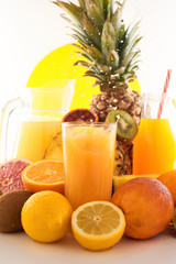 Fresh juice dynamic splash. A glass of fruit drink and fruits on a white background. Delicious, tasty, sweet summer set. 