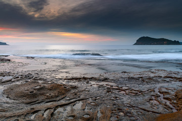 Soft High Cloud Sunrise Seascape from Rock Platform
