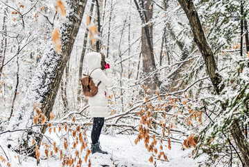 young girl in winter forest