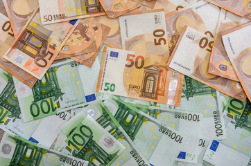Obraz na płótnie Canvas Euro banknotes as background on wooden desk 