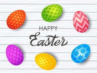 Colorful Easter greeting card. Easter painted eggs with an ornament on a wooden background with hand-made retro inscription. vector