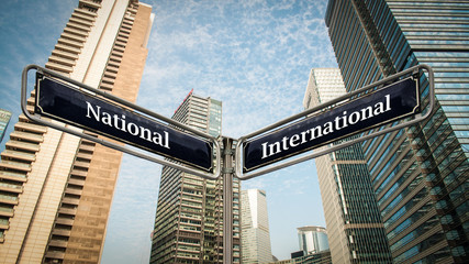 Fototapeta na wymiar Street Sign International versus National