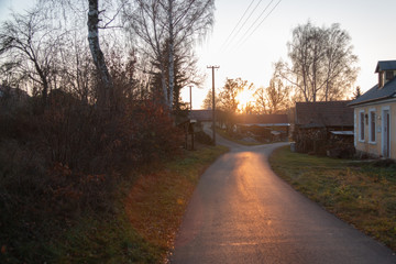 Sunset above the roofs of a village