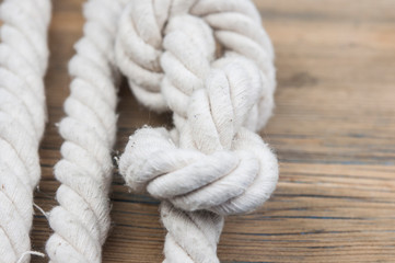 Fototapeta premium Close up of wooden panels with knot rope