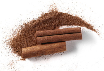 Cinnamon sticks and powder isolated on white background, top view