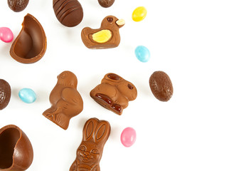 Easter composition with chocolate eggs and animals isolated on white