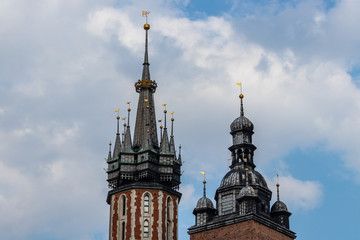 Fototapeta na wymiar Towers of St. Mary's Church on the Main Square in Krakow, Poland