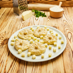 Georgian dumplings Khinkali with cheese, greens and tomato spicy sauce Satsebeli on white plate