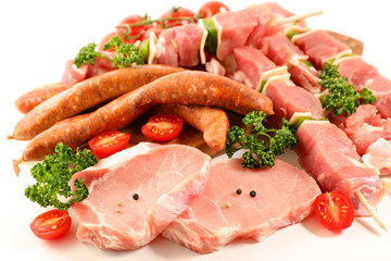 assorted raw meats isolated on white background