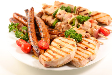 assorted barbecue meat with sausage, pork chop and beef skewer