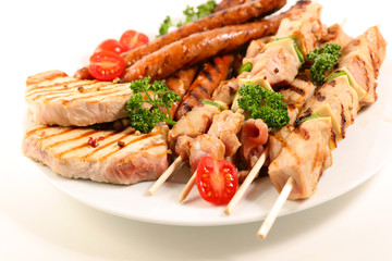 assorted barbecue meat with sausage, pork chop and beef skewer