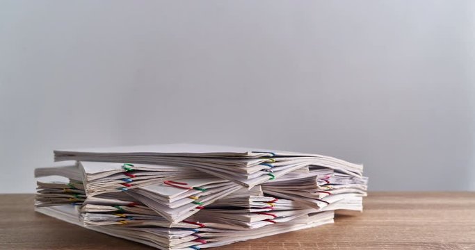 Pile overload document of report on wood table time lapse