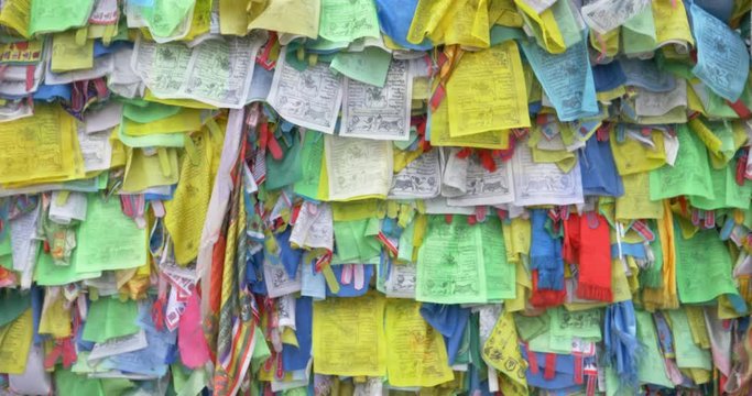 Colorful Tibetan prayer flags swaying in the wind in the temple, Ulan Ude Russia