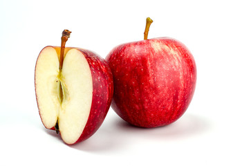 Red apple with apple half on white background. New zealand queen apple