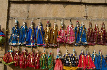 Colorful Kathputli or Puppets displayed on the wall, near Patwon Ki Haveli, Jaisalmer, Rajasthan,...