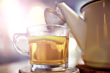 English tea in a cafe / cup and kettle with five o'clock tea