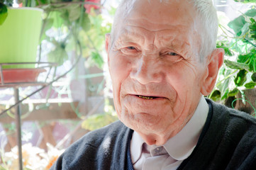 Portrait of Grandfather. Elderly man smiling and looking at camera