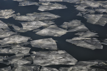 spring ice drift on the river / background texture floating ice, March on the river